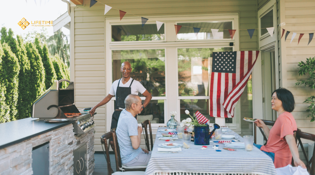 Outdoor kitchen with built-in BBQ island where guests gather, featuring grill, counter seating, and ambient lighting for entertaining.