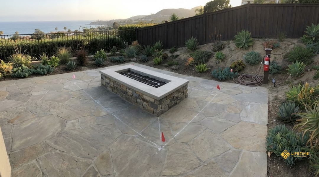 Residential backyard fire pit setup showing safety clearances and site-specific conditions in a Laguna Beach home